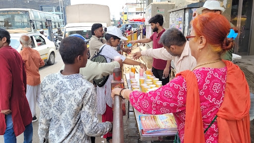 Distribution of Sharbat to pedestrians to combat the scorching heat on Marathahlli.